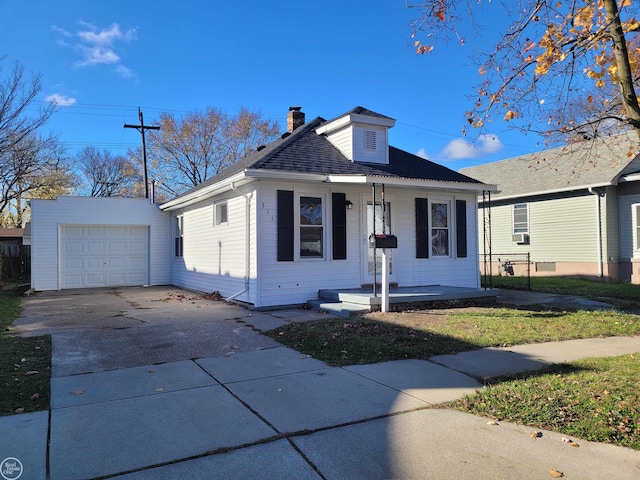 view of front of house featuring an outbuilding and a garage