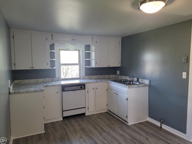 kitchen featuring white dishwasher, white cabinets, sink, and dark wood-type flooring