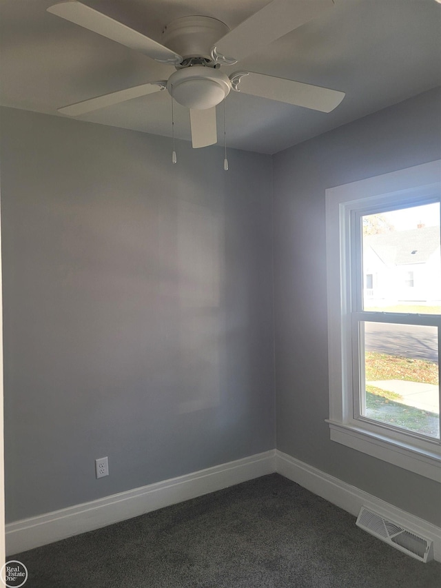 carpeted empty room with ceiling fan