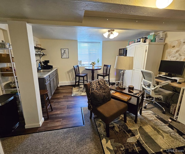 dining room with dark hardwood / wood-style flooring and a textured ceiling