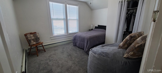 carpeted bedroom featuring a closet, baseboard heating, and vaulted ceiling