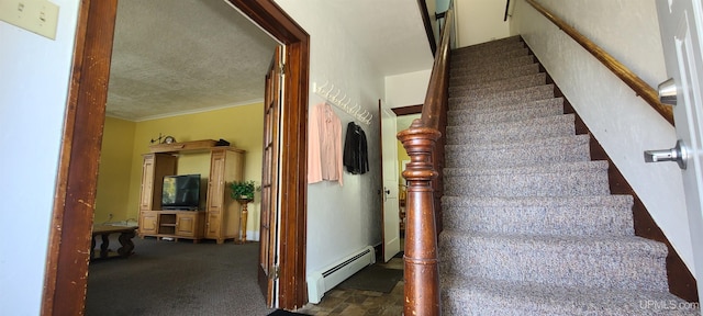 stairway with carpet floors, crown molding, and a baseboard heating unit