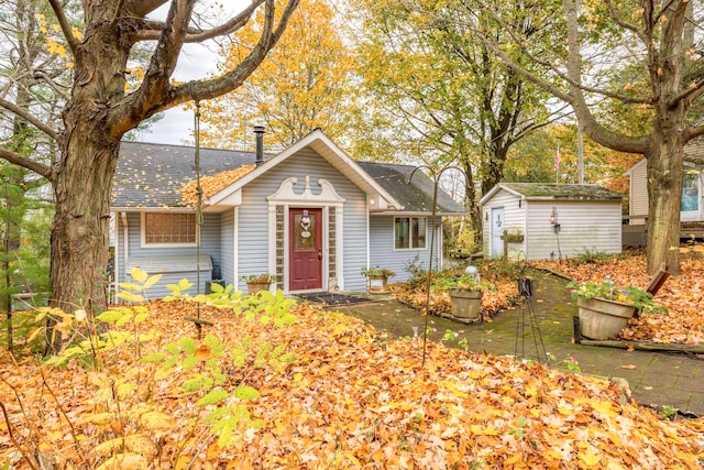 ranch-style house with a storage shed