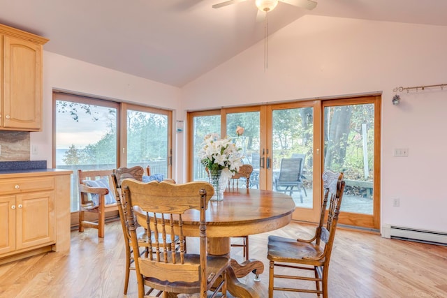 dining space featuring ceiling fan, a healthy amount of sunlight, french doors, and light hardwood / wood-style flooring