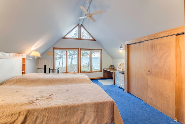 unfurnished bedroom with ceiling fan, lofted ceiling, light carpet, and a closet