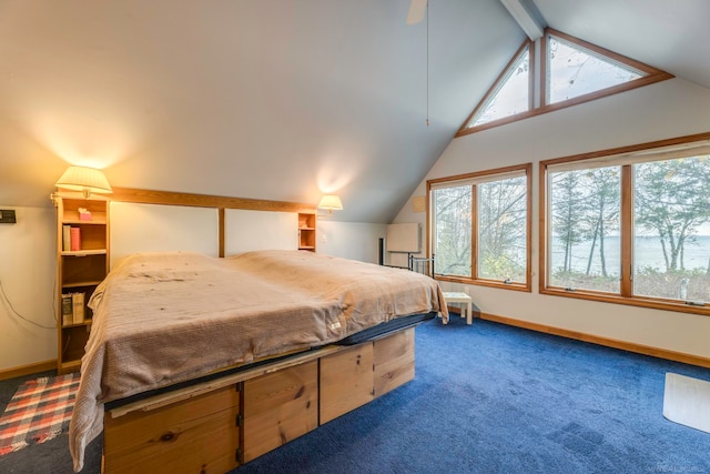 carpeted bedroom with lofted ceiling with beams and ceiling fan