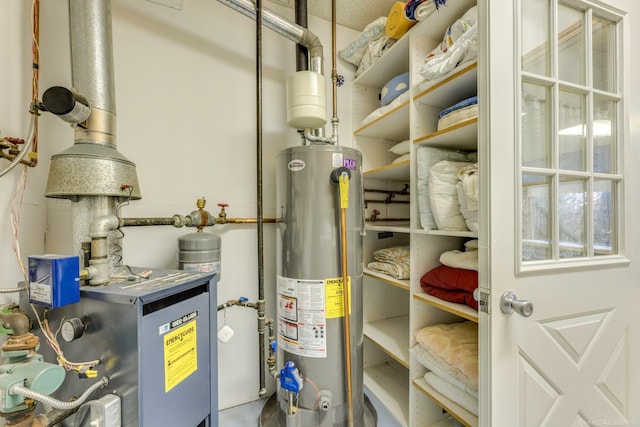 utility room with gas water heater