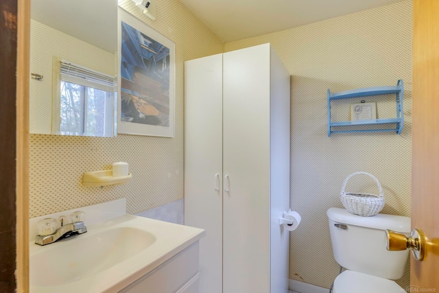 bathroom with vanity and toilet