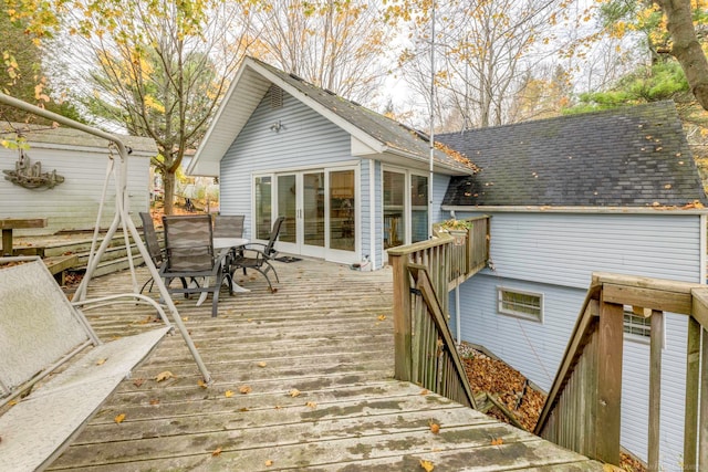 wooden deck featuring a sunroom