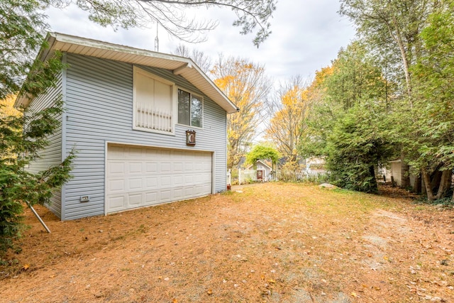 view of side of home with a garage