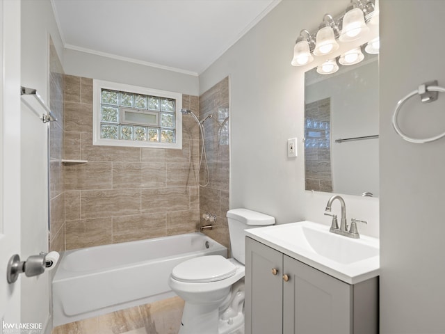 full bathroom featuring vanity, toilet, tiled shower / bath, and ornamental molding