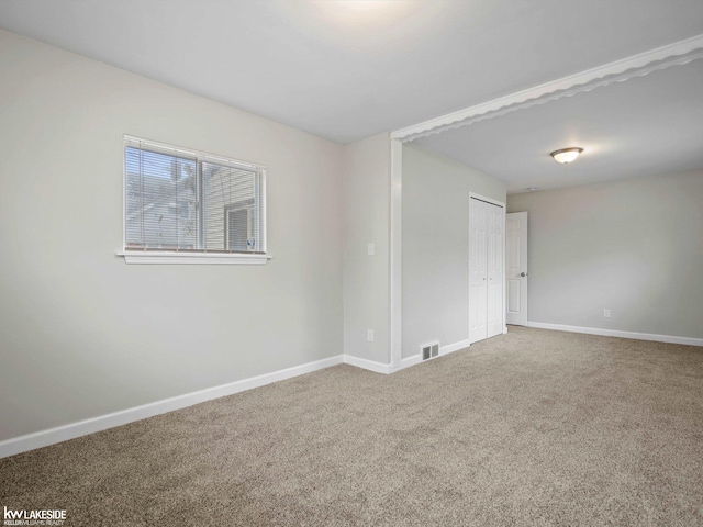 view of carpeted spare room