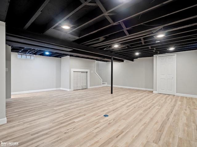 basement featuring light hardwood / wood-style floors