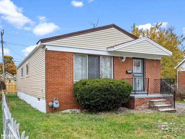 bungalow-style house with a front yard