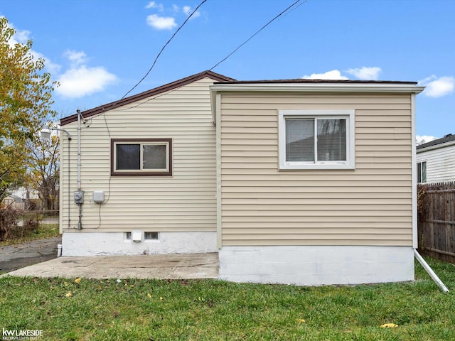 view of home's exterior with a yard