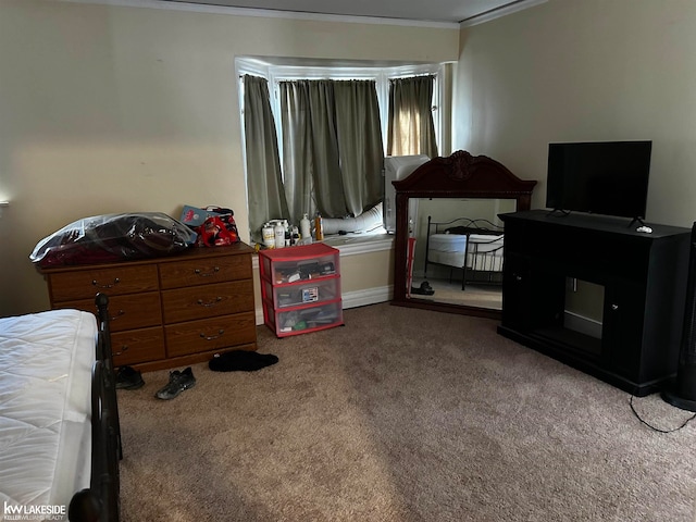 carpeted bedroom featuring crown molding