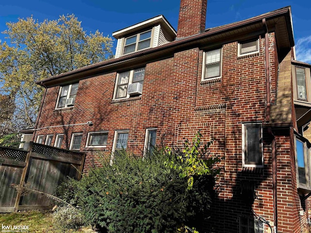 view of side of home featuring cooling unit