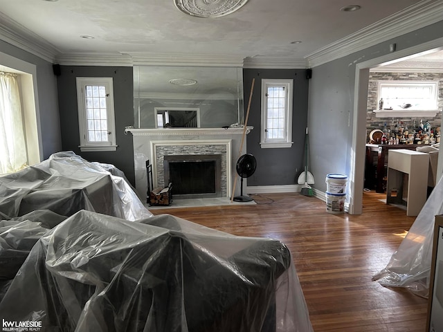 living room with hardwood / wood-style floors and ornamental molding