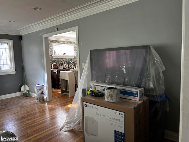 details featuring hardwood / wood-style flooring and crown molding