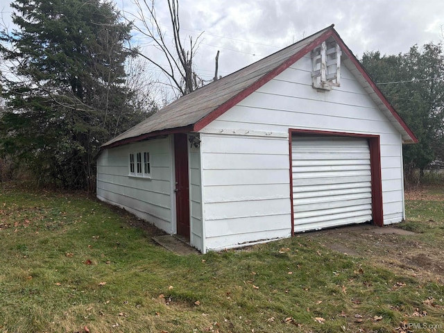 garage featuring a yard