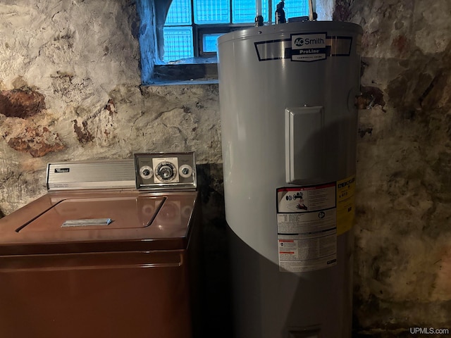 utility room featuring washer / clothes dryer and water heater