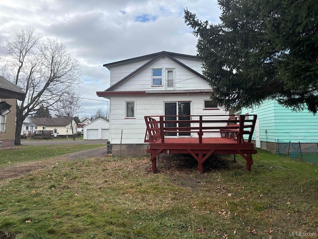 back of property featuring a yard and a deck