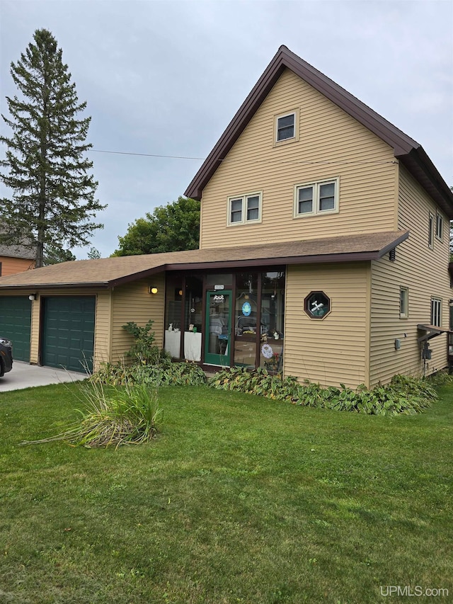 front facade featuring a front yard and a garage