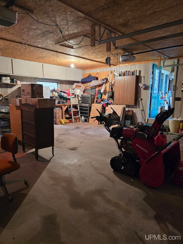 garage featuring a workshop area and a garage door opener