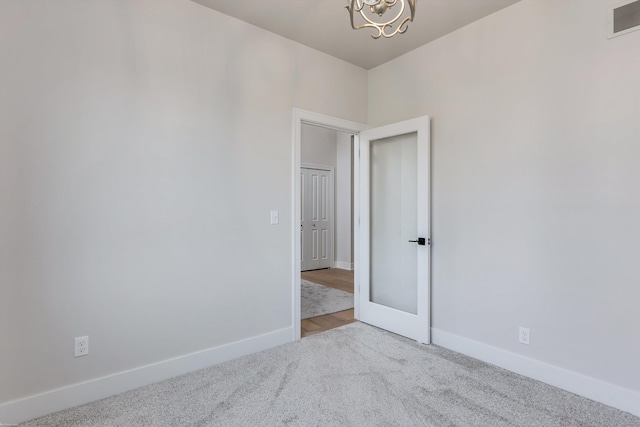 unfurnished room with carpet floors