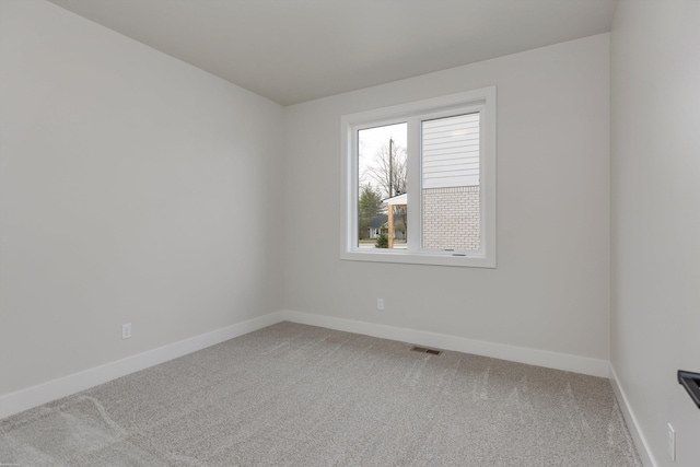 unfurnished room with carpet floors