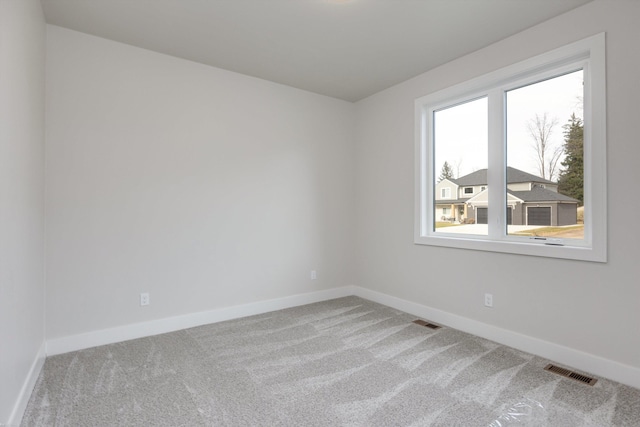 unfurnished room with carpet flooring