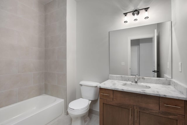 full bathroom with tile patterned flooring, vanity, toilet, and tiled shower / bath combo