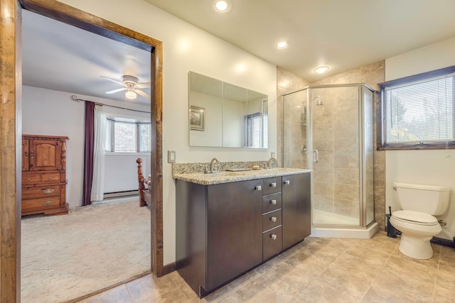 bathroom with ceiling fan, toilet, walk in shower, and vanity