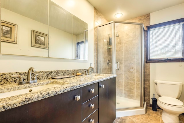 bathroom featuring walk in shower, tile patterned flooring, vanity, and toilet