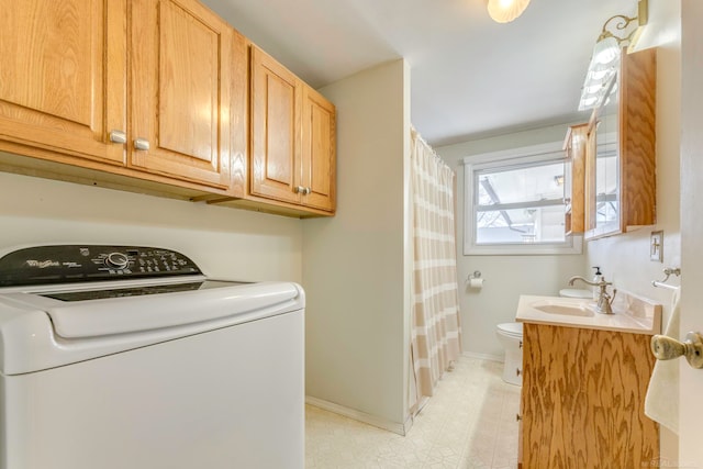 laundry area featuring washer / dryer and sink