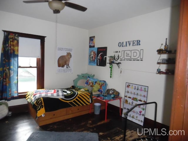 bedroom with ceiling fan and wood-type flooring