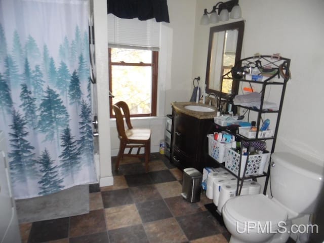 bathroom with vanity and toilet