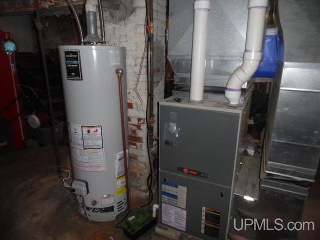 utility room featuring water heater