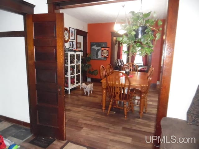 dining area featuring dark hardwood / wood-style floors