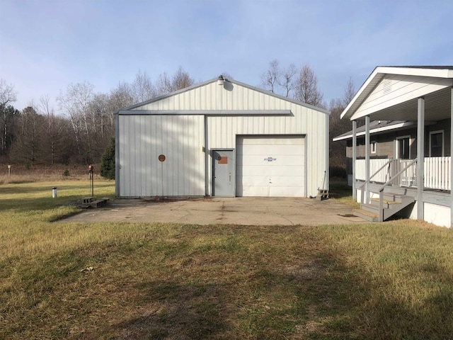 garage featuring a lawn