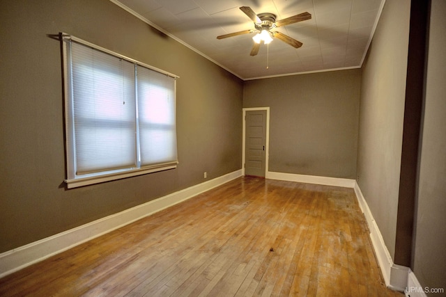 spare room featuring ceiling fan, light hardwood / wood-style flooring, and ornamental molding