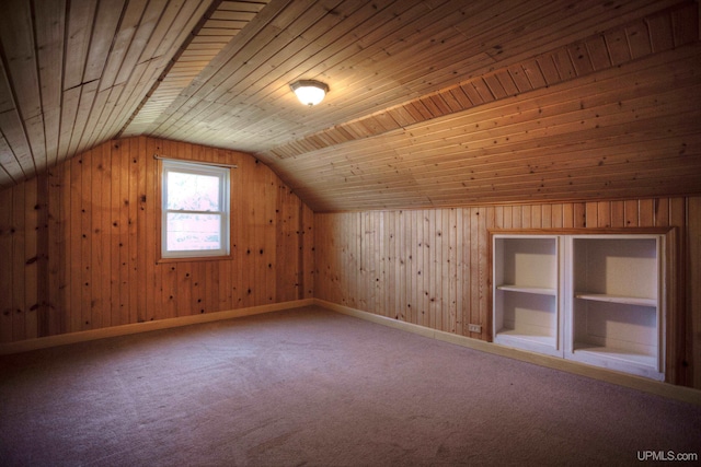 bonus room with carpet, wooden walls, lofted ceiling, and wood ceiling