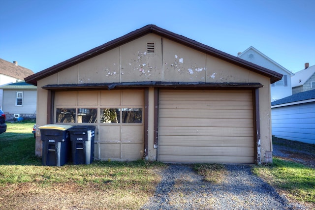 exterior space with an outdoor structure and a garage