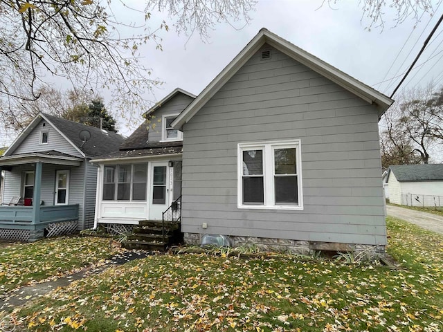 rear view of house with a lawn