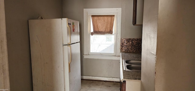 kitchen with sink and white refrigerator