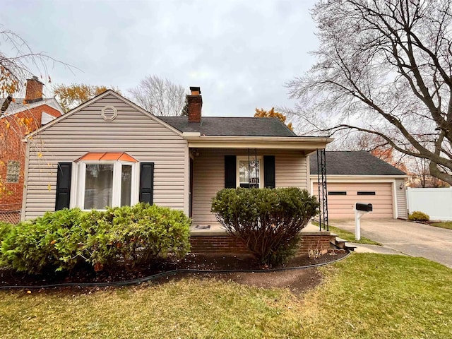 bungalow-style house featuring a front yard and a garage