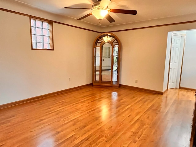 unfurnished room with ceiling fan and light hardwood / wood-style flooring