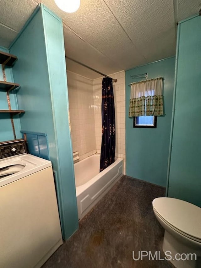 bathroom featuring washer / dryer, a textured ceiling, toilet, and shower / bath combo with shower curtain