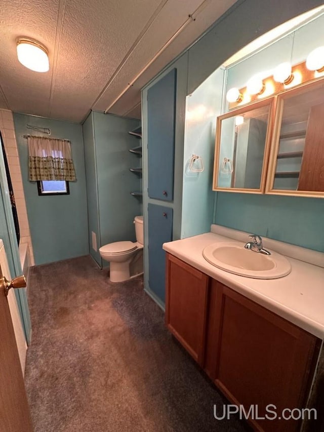 full bathroom featuring vanity, toilet, a textured ceiling, and independent shower and bath