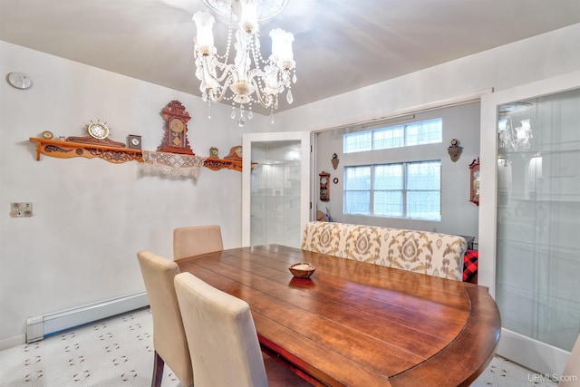 dining space featuring a chandelier and a baseboard heating unit